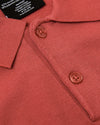 Garnet Short Sleeve Sweater Polo, showcasing collar and buttons, fabric tag details.