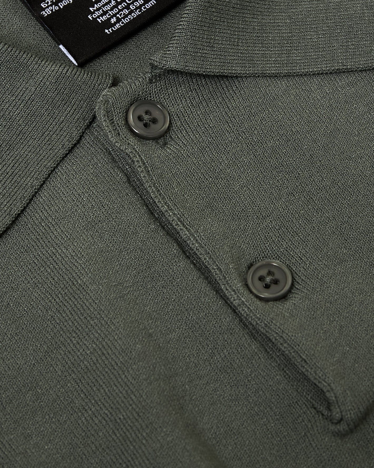 Moss Short Sleeve Sweater Polo with folded collar and two buttons.