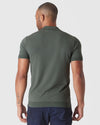 Back view of man in Moss Short Sleeve Sweater Polo.