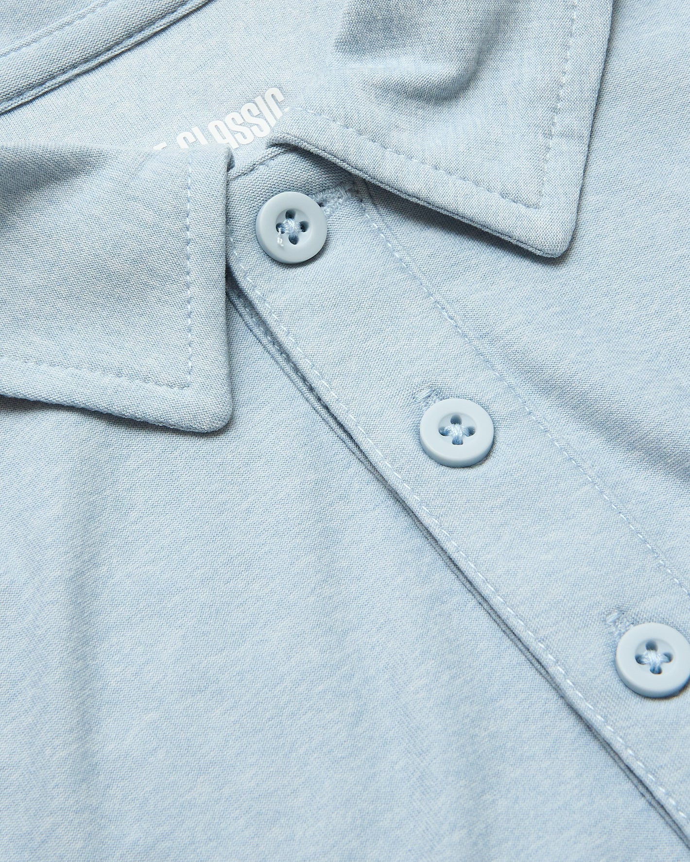 Arctic Active Polo 2.0: Close-up of light-blue collared shirt with buttons.