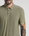 Heather Military Green Active Polo 2.0 on tattooed man's upper body.