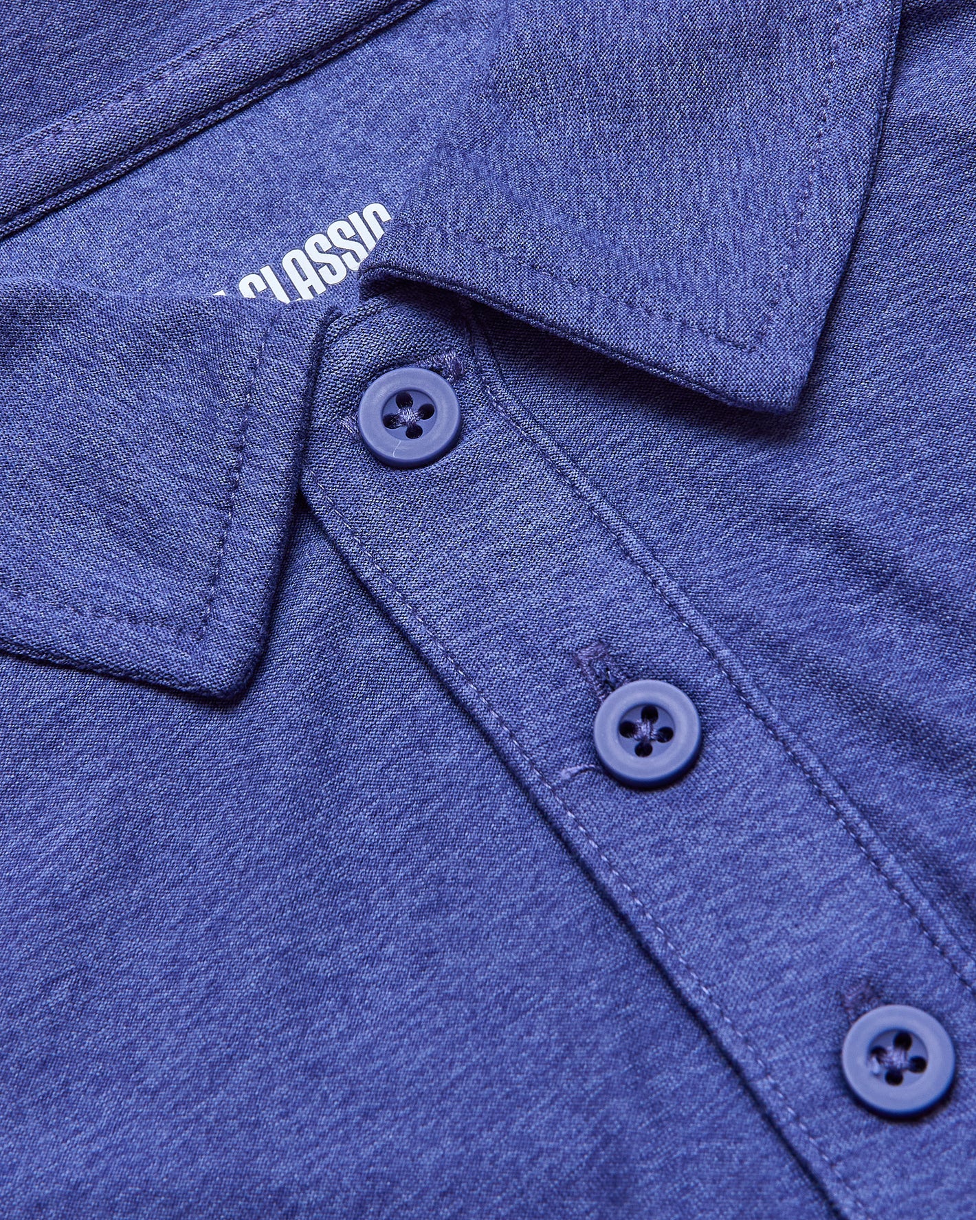 Cosmos Active Polo 2.0 close-up showing collar and buttons.