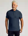 Middle-aged man modeling True Classic Men’s Active Short Sleeve Polo.