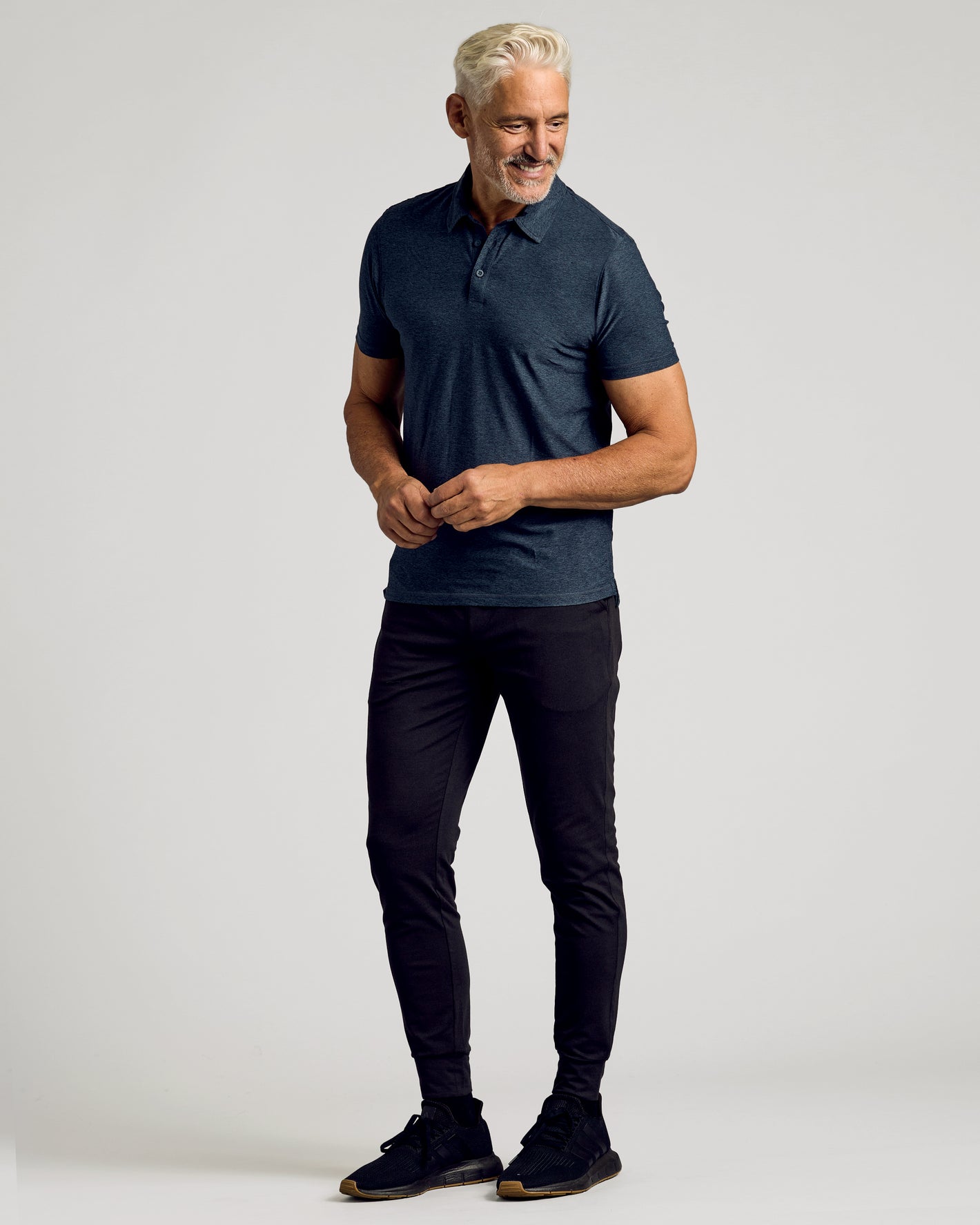 Dark Heather Fiord Active Polo 2.0 worn by a mature man.