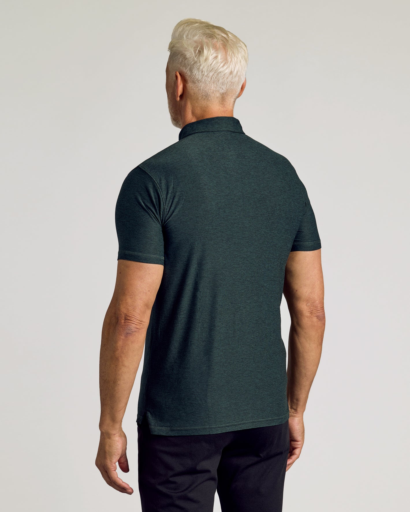 Dark Heather Forest Active Polo 2.0 back view on male model.