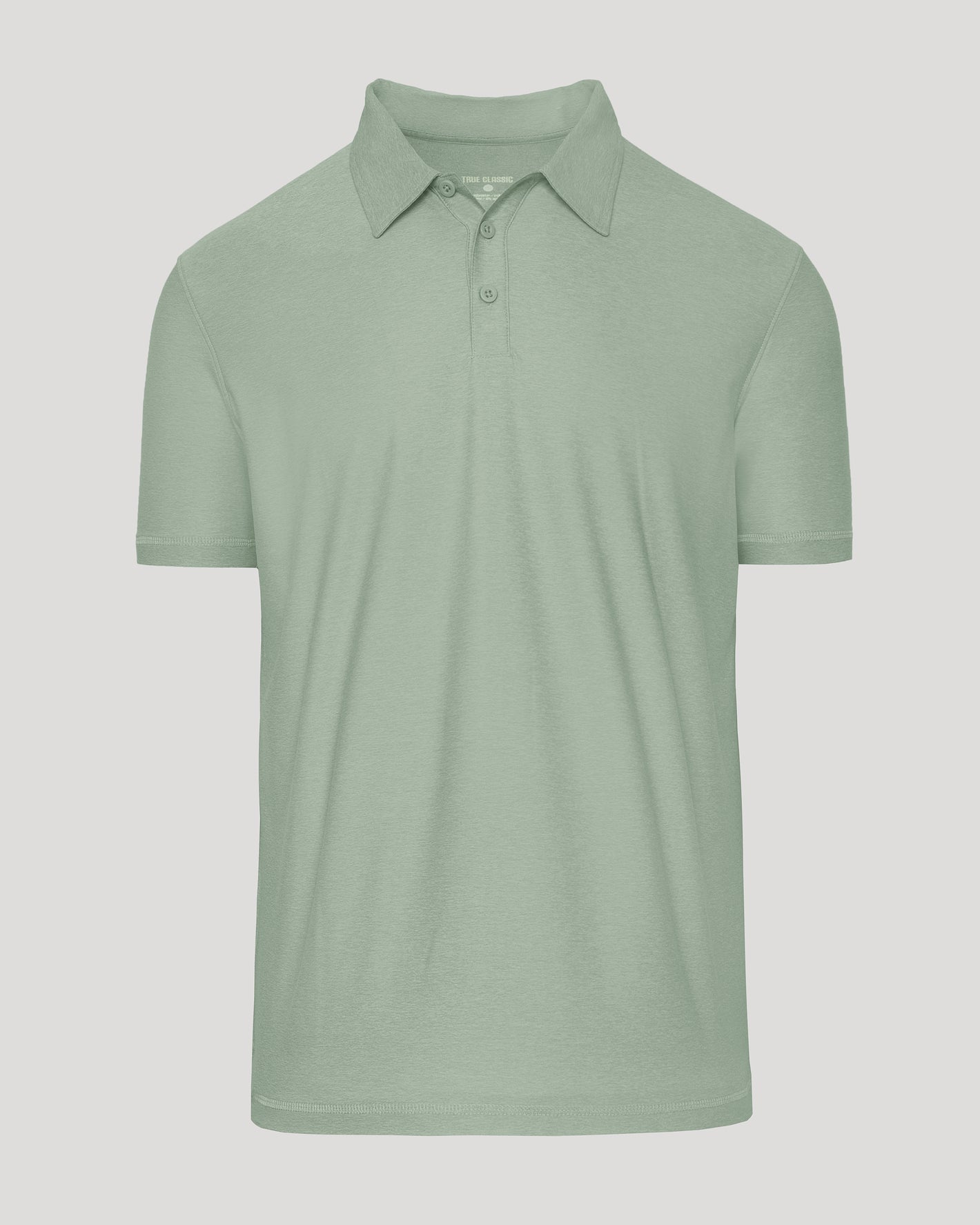 Lichen Active Polo 2.0: Sage-green, short-sleeve, two-button placket, unstructured collar.