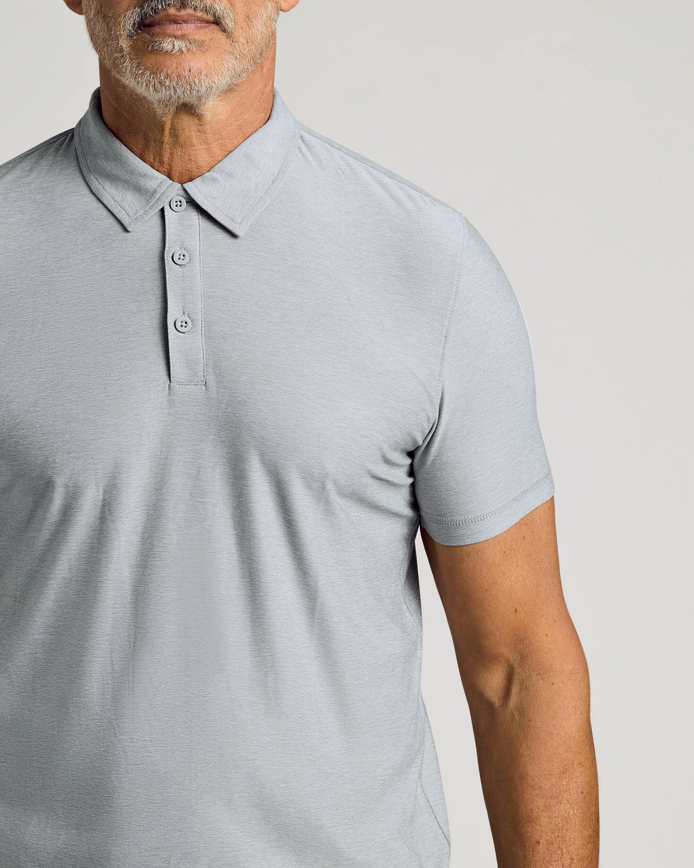 Man wearing Light Heather Gray Active Polo 2.0 with classic collar.