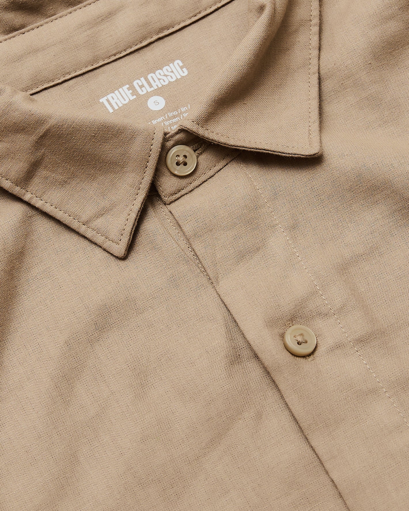 Dusty Taupe Short Sleeve Linen Shirt close-up showing collar and buttons.