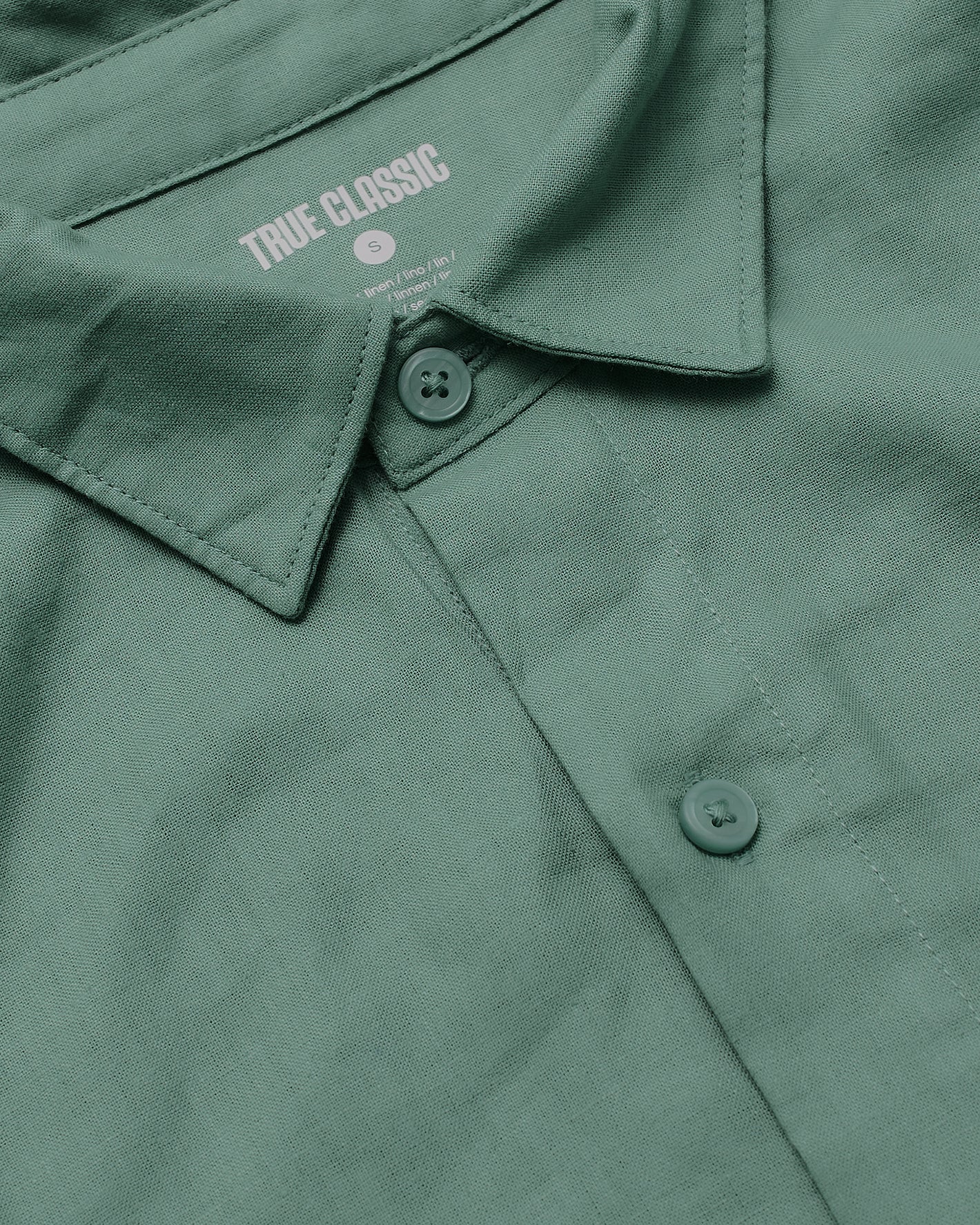 Moss Short Sleeve Linen Shirt collar and placket close-up.