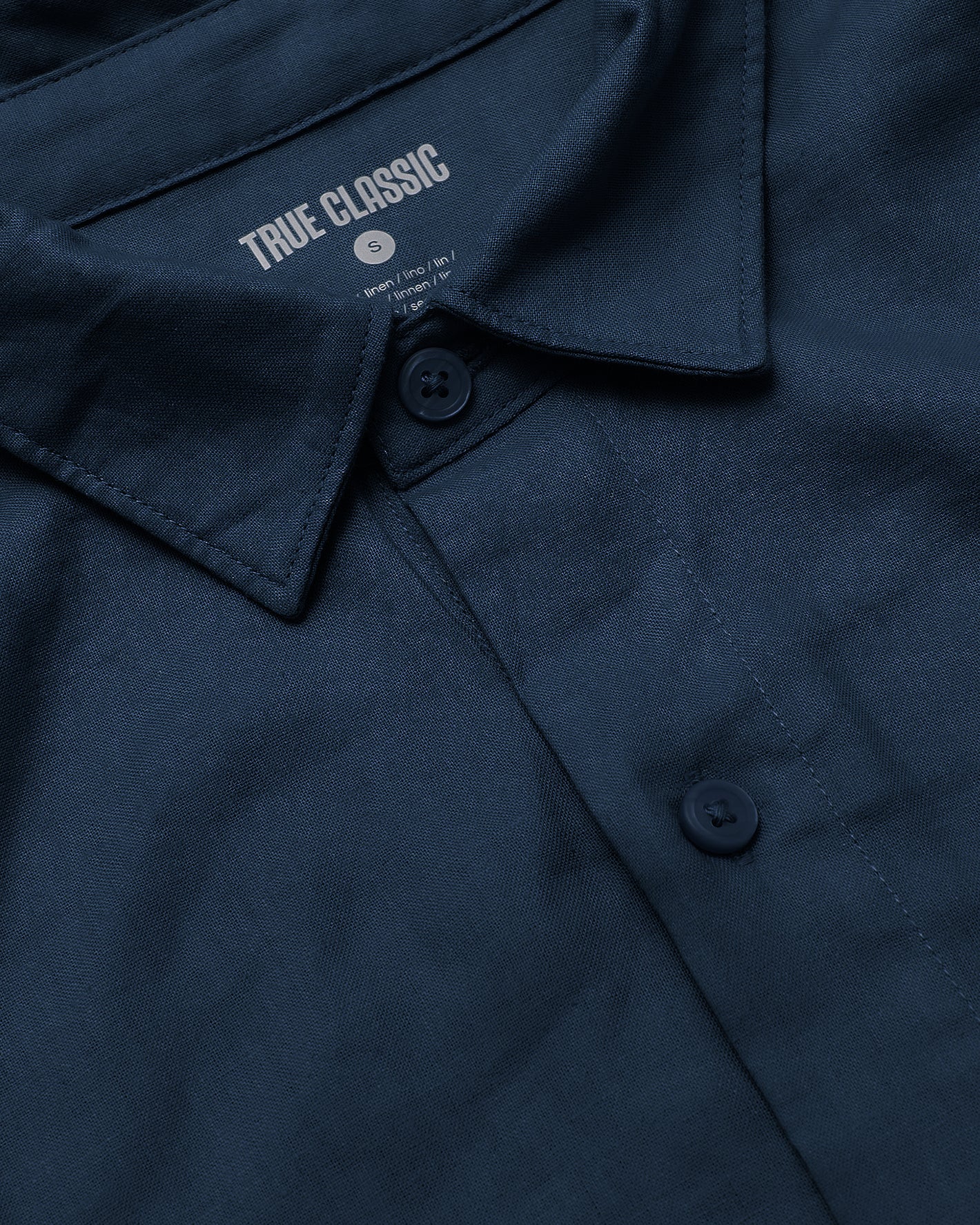Navy Short Sleeve Linen Shirt collar with buttons and TRUE CLASSIC label.