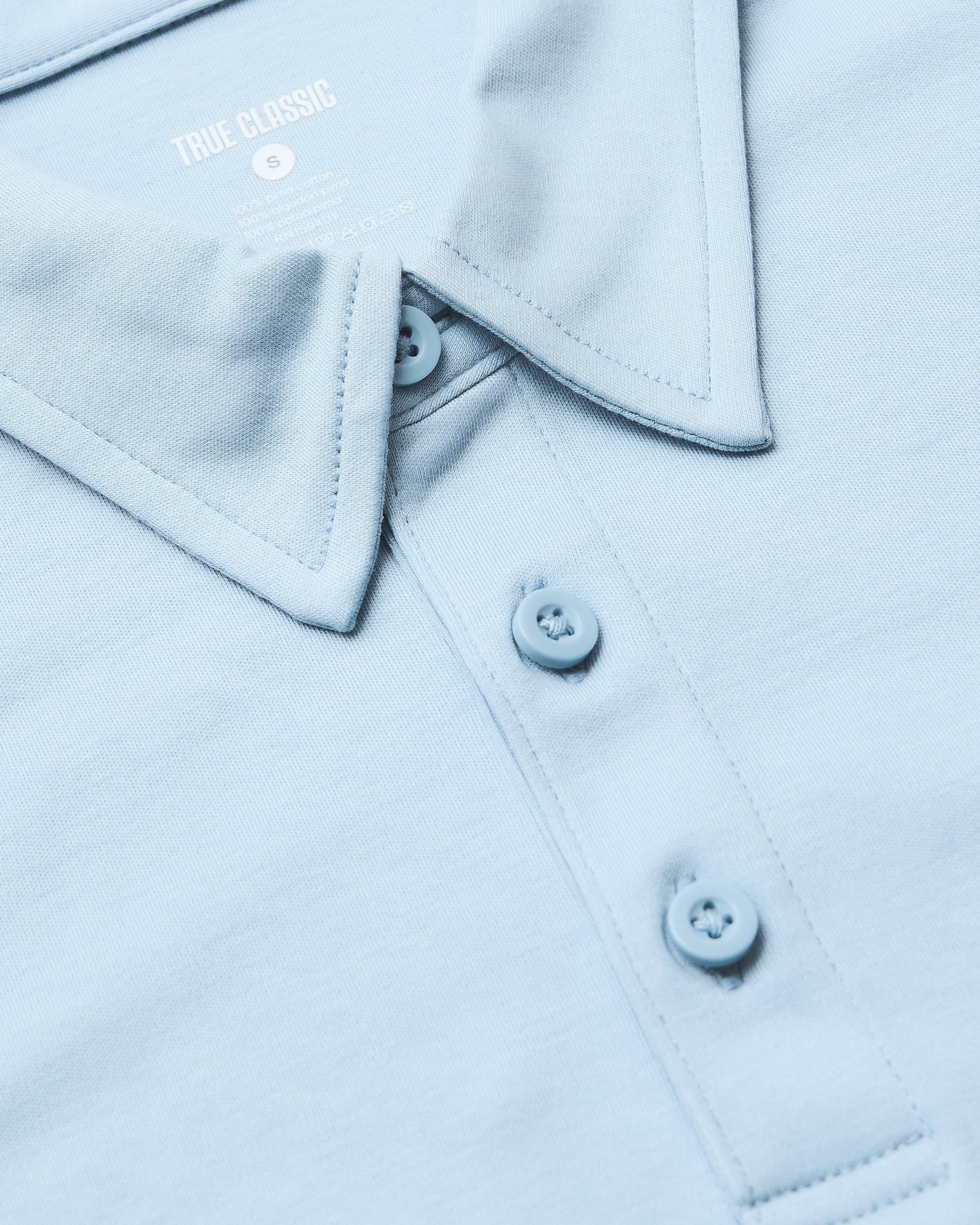 Ether Premium Pima Polo, light blue, close-up of collar and buttons.