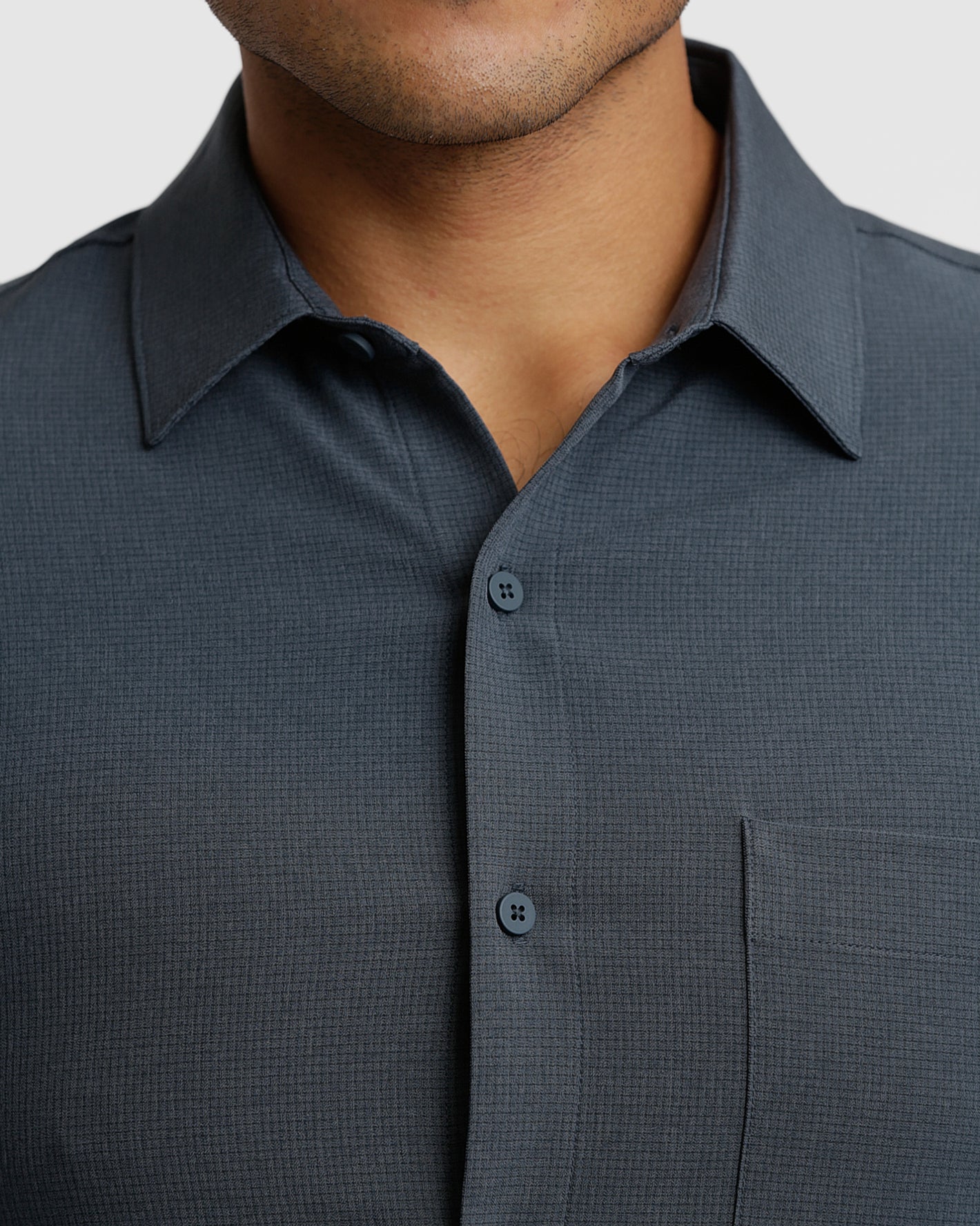Heather Navy Short Sleeve Ripstop Commuter Shirt 1 with textured fabric and chest pocket.