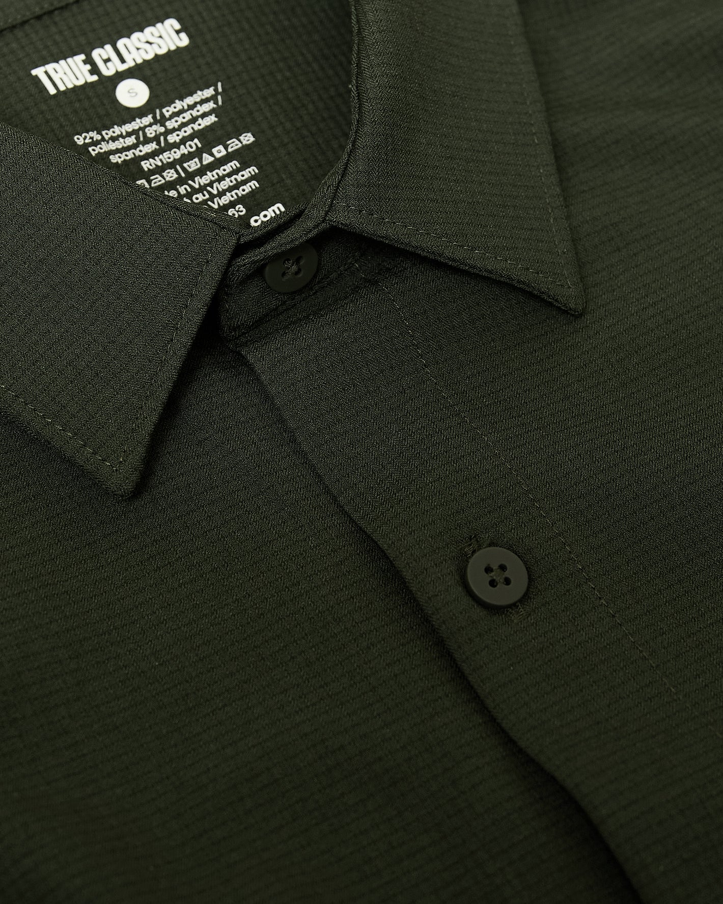 Olive Short Sleeve Ripstop Commuter Shirt with collar and buttons visible.
