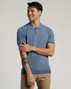Man wearing Fiord Dressy Polo, smiling with relaxed expression.