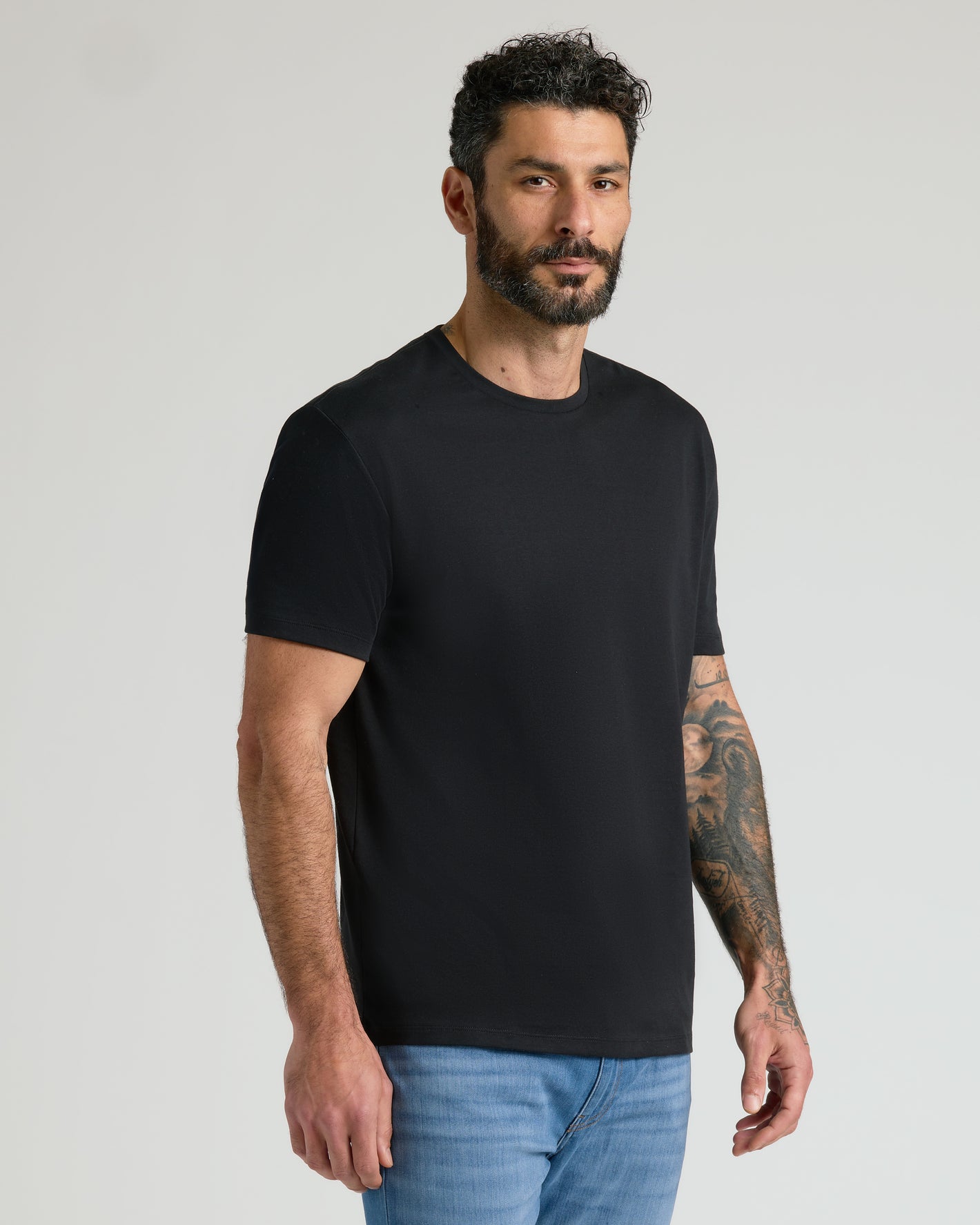 Man wearing Black Premium Pima Crew Neck Tee from 7-Pack.