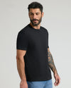 Black Premium Pima Crew Neck 4-Pack on model with tattooed forearm.