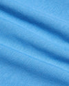 Close-up of Cerulean Premium Pima Crew Neck's textured blue fabric.