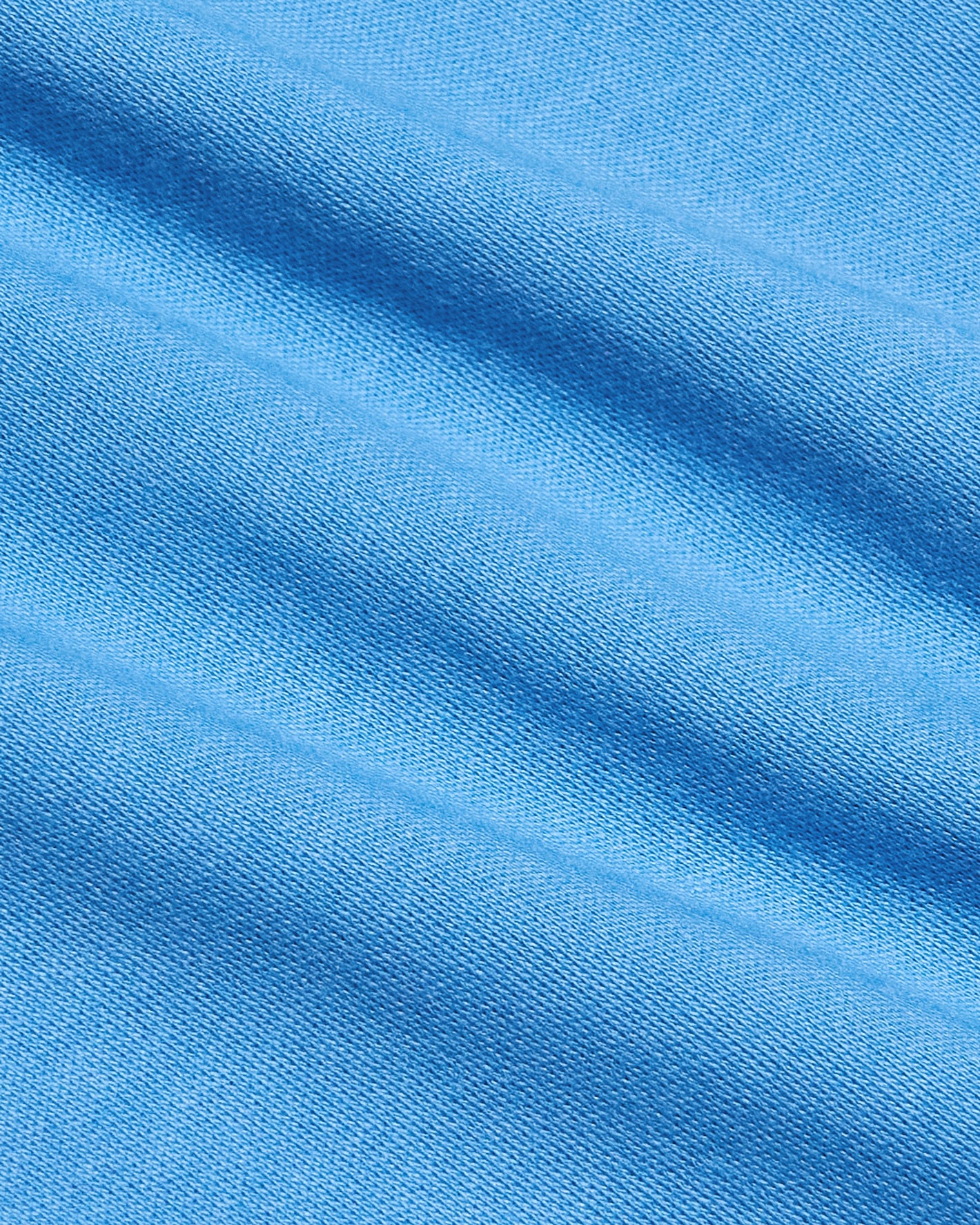 Close-up of Cerulean Premium Pima Crew Neck's textured blue fabric.
