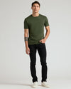 Young man wearing Premium Pima Crew 7-Pack olive green tee.
