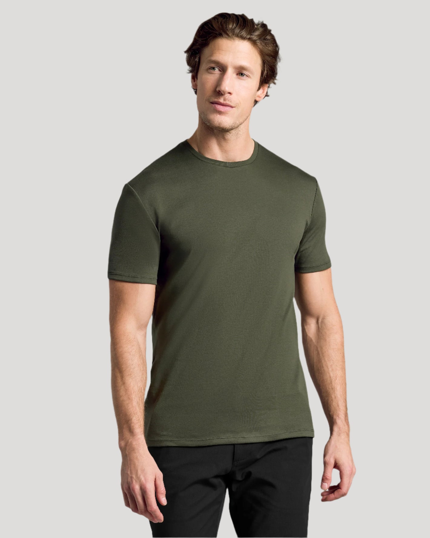 Model wearing The Staple Premium Pima Crew Neck T-shirt in olive.