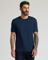 Man wearing Core Premium Pima Crew Neck T-shirt in navy.
