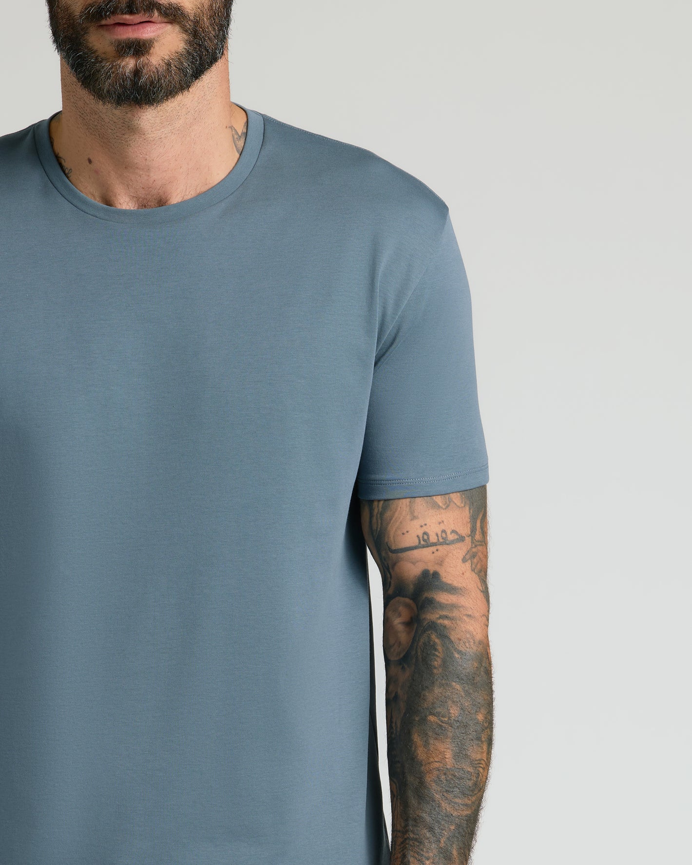 Tempest Premium Pima Crew Neck showcasing arm tattoos.