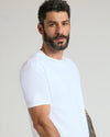 White Premium Pima Crew Neck on bearded man, showcasing fit and tattoos.