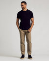 Man wearing Classic Curved Hem Crew T-shirt with khaki trousers.