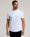 Man in White Curved Hem Classic Crew Neck T-Shirt, relaxed pose.