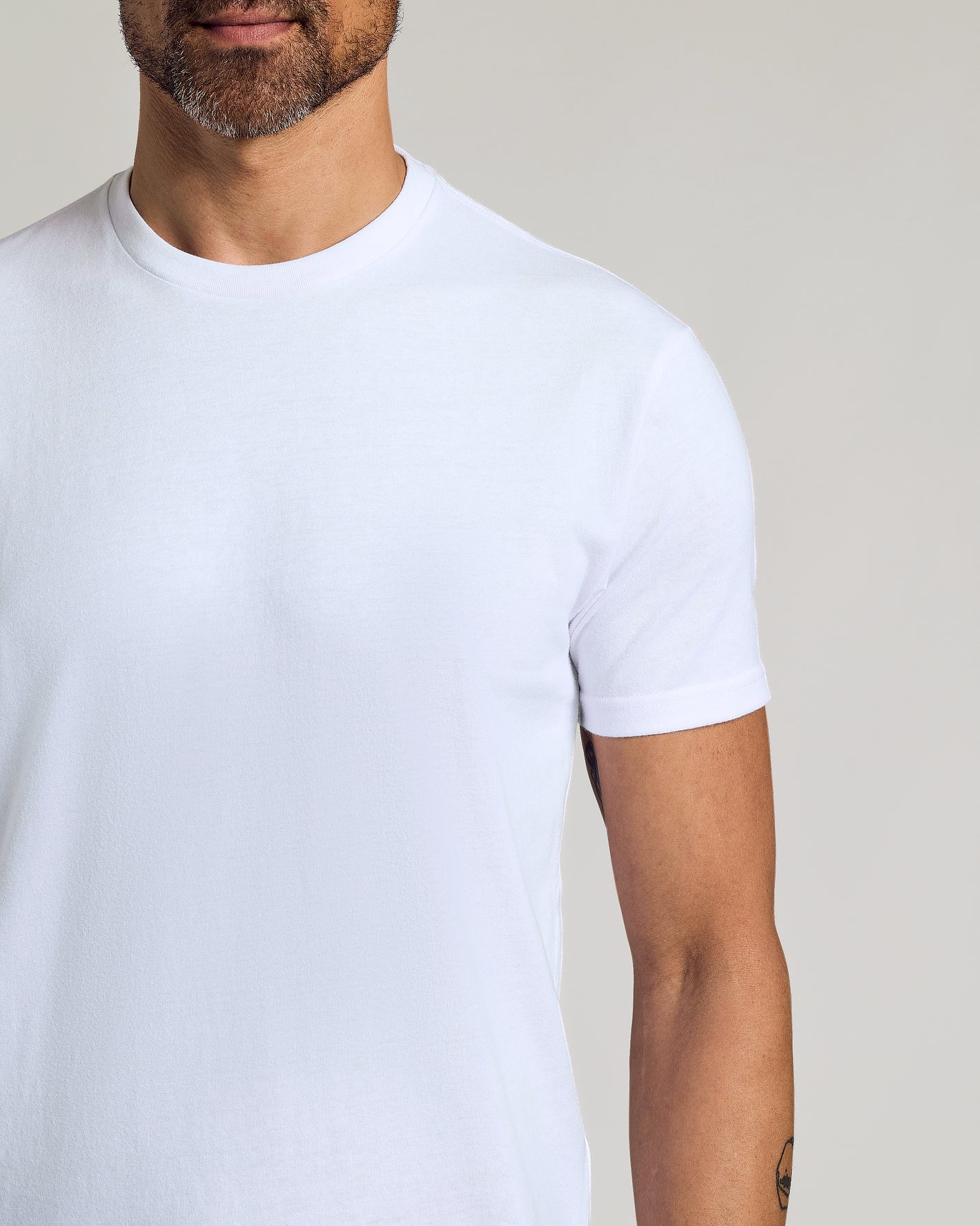 Man wearing All White Curved Hem Classic Crew Neck T-shirt.