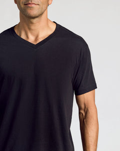 True ClassicAll Black Classic V-Neck 10-Pack on a man against a neutral background.