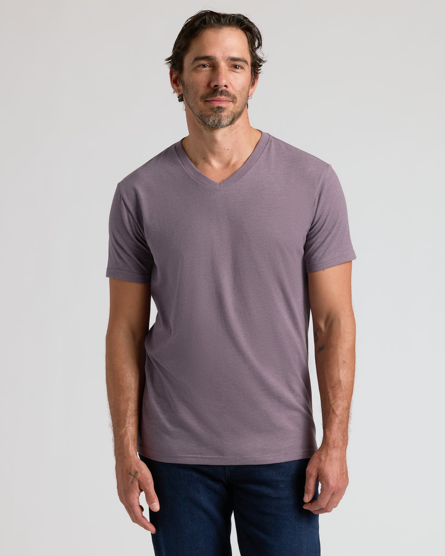 Model in Limited Seasonal Classic V-Neck 3-Pack T-shirt and jeans.