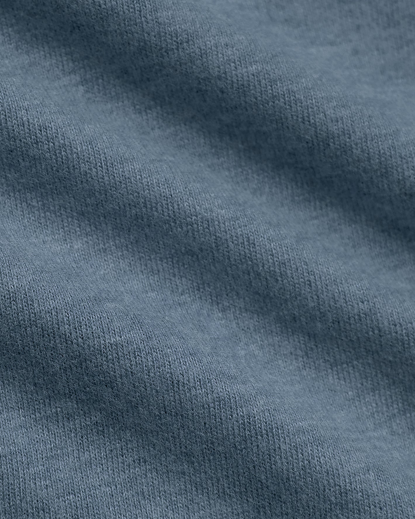 Dark Heather Tempest Classic V-Neck, showcasing soft knit texture details.