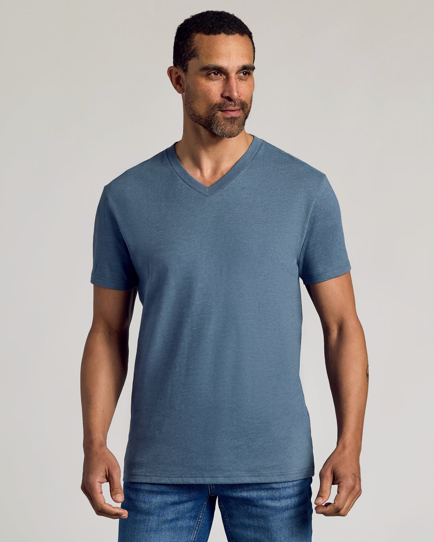 Man in slate-blue V-neck tee from Limited Seasonal Classic V-Neck 3-Pack.