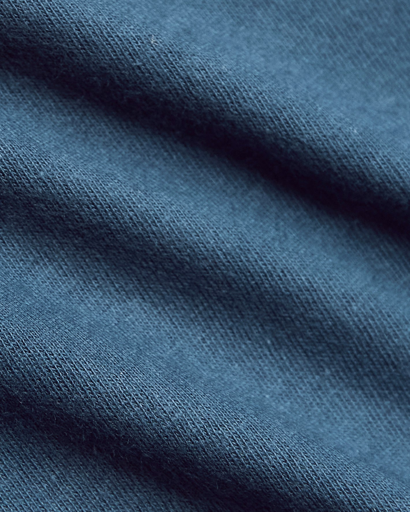 Fiord Classic V-Neck knit fabric close-up, showcasing fine weave.