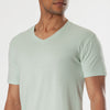 Green Lapis V-Neck Tee on model, showcasing its fitted design.