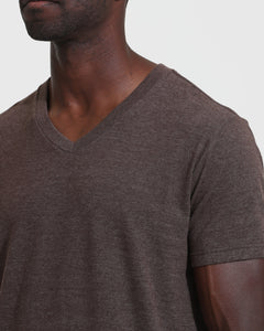 True ClassicPerson wearing Heather Dark Oak Classic V-Neck T-shirt, showcasing its fit.
