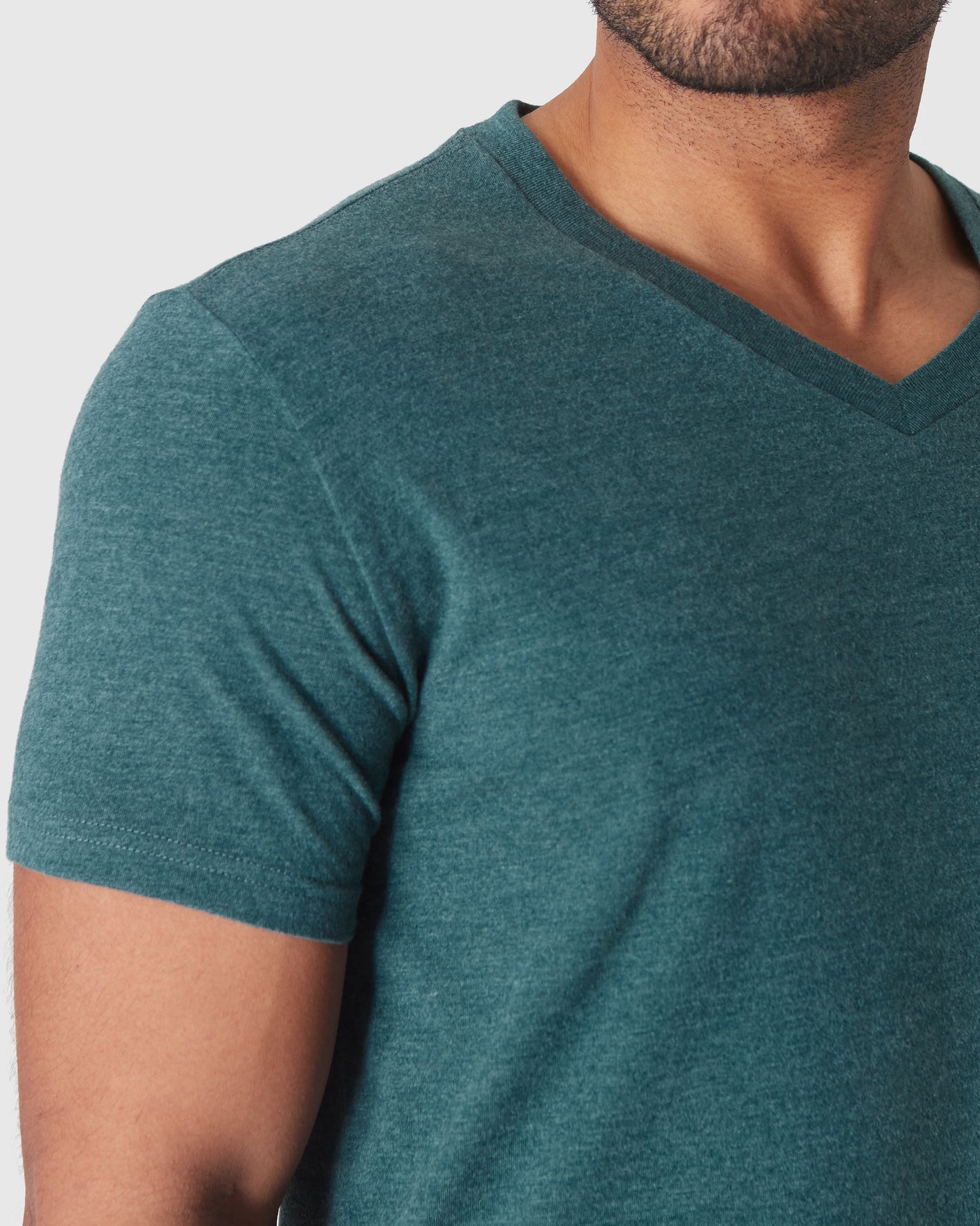 Heather Seafarer Classic V-Neck on model's torso with light stubble.