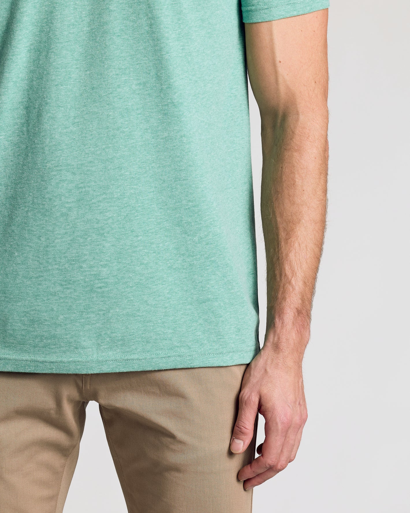Light Heather Greenery Classic V-Neck shirt showcasing a fitted, soft design.