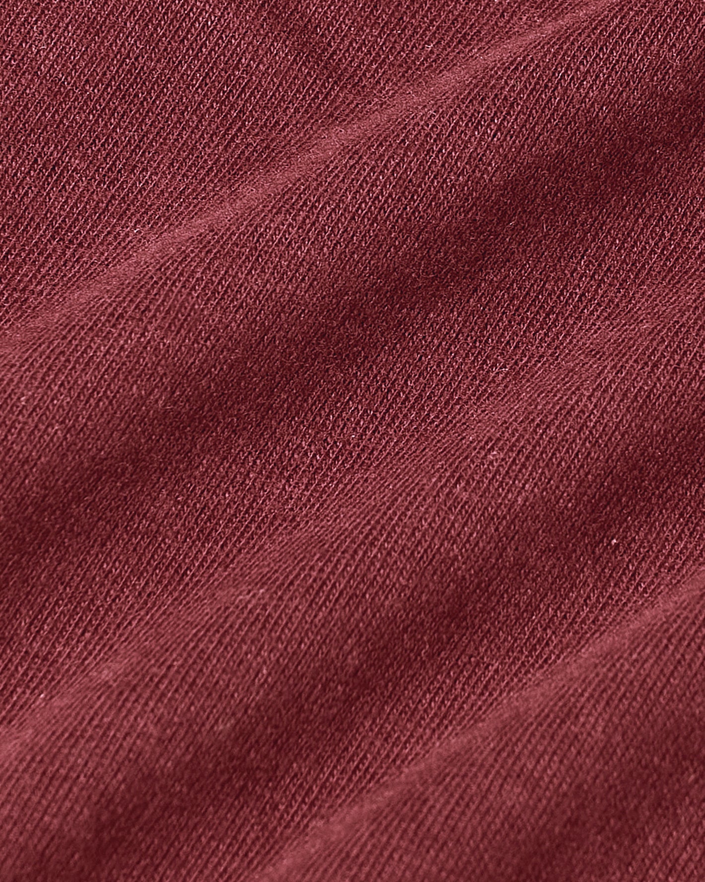 Rustic Apple Classic V-Neck fabric close-up, showcasing knit texture.