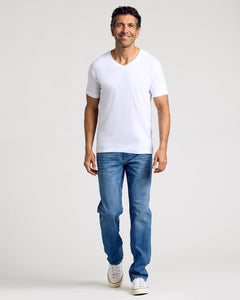 True ClassicMan in All White Classic V-Neck T-Shirt, relaxed and smiling.