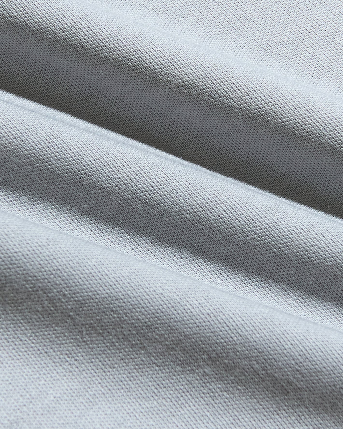 Steel Premium Pima V-Neck knit textile close-up, showcasing its silky texture.