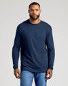 Man wearing Standard Long Sleeve Crew 3-Pack in navy and jeans.