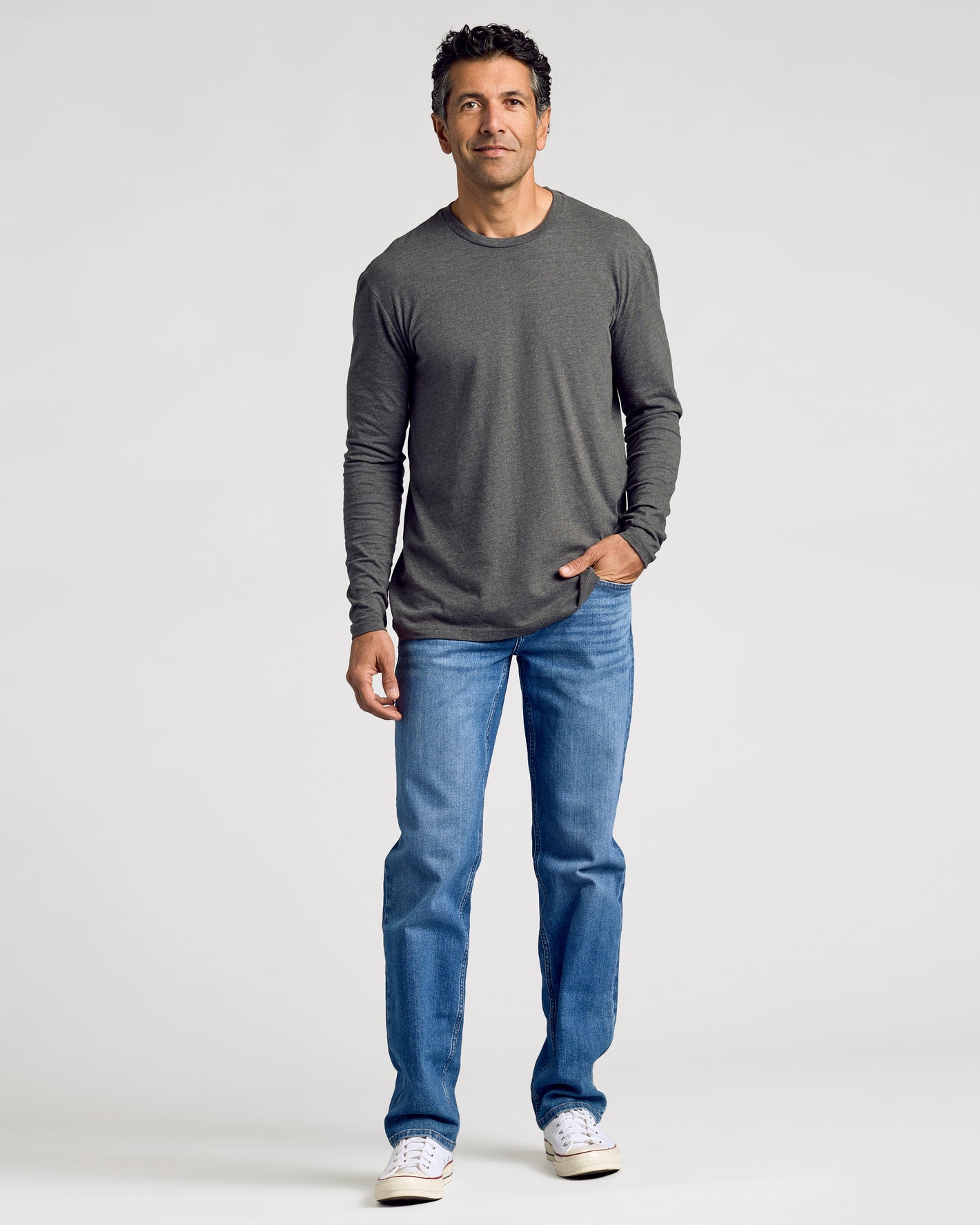 Man wearing Heathers Classic Long Sleeve 3-Pack with jeans and sneakers.