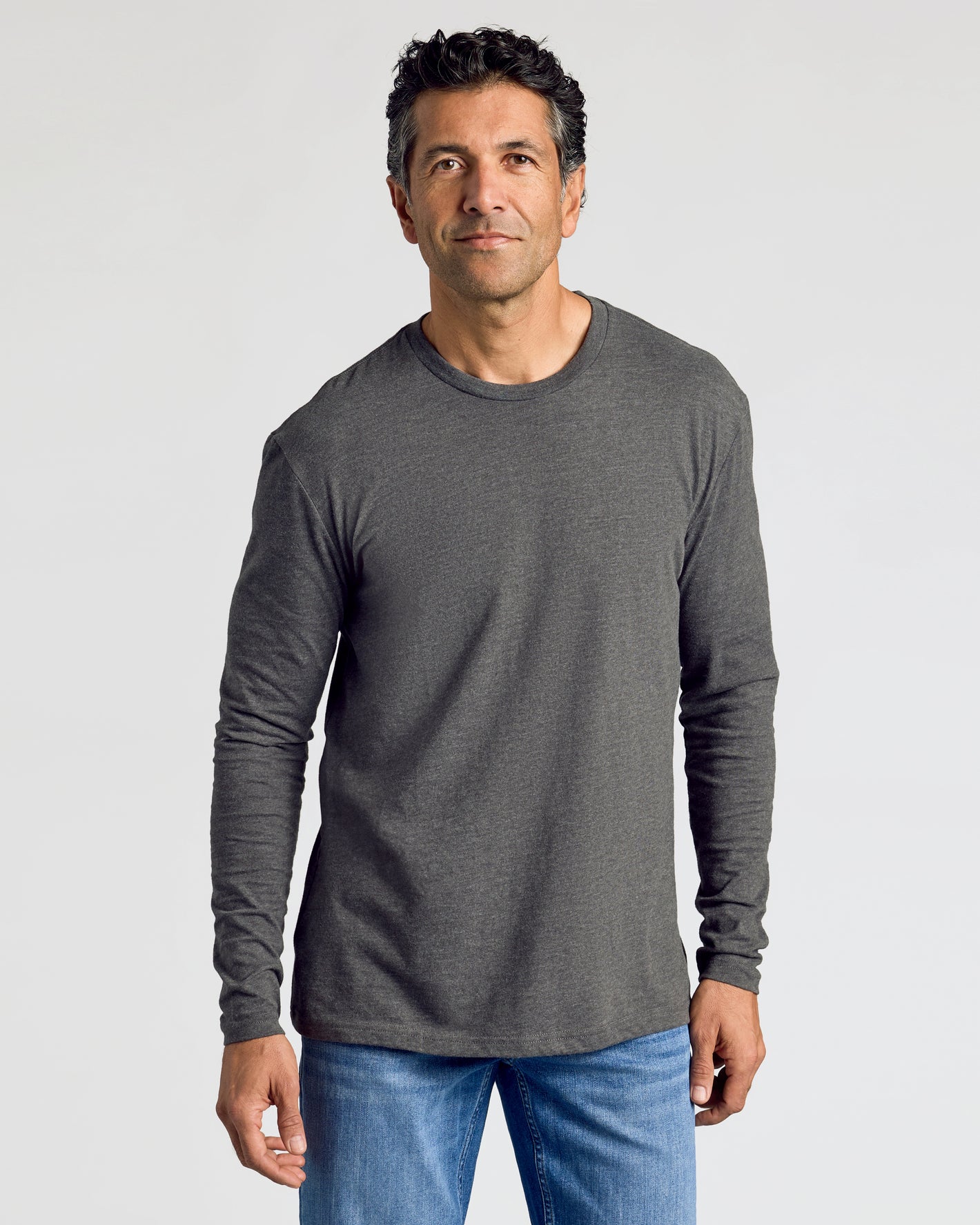 Man wearing Heathers Classic Long Sleeve 3-Pack shirt and jeans.