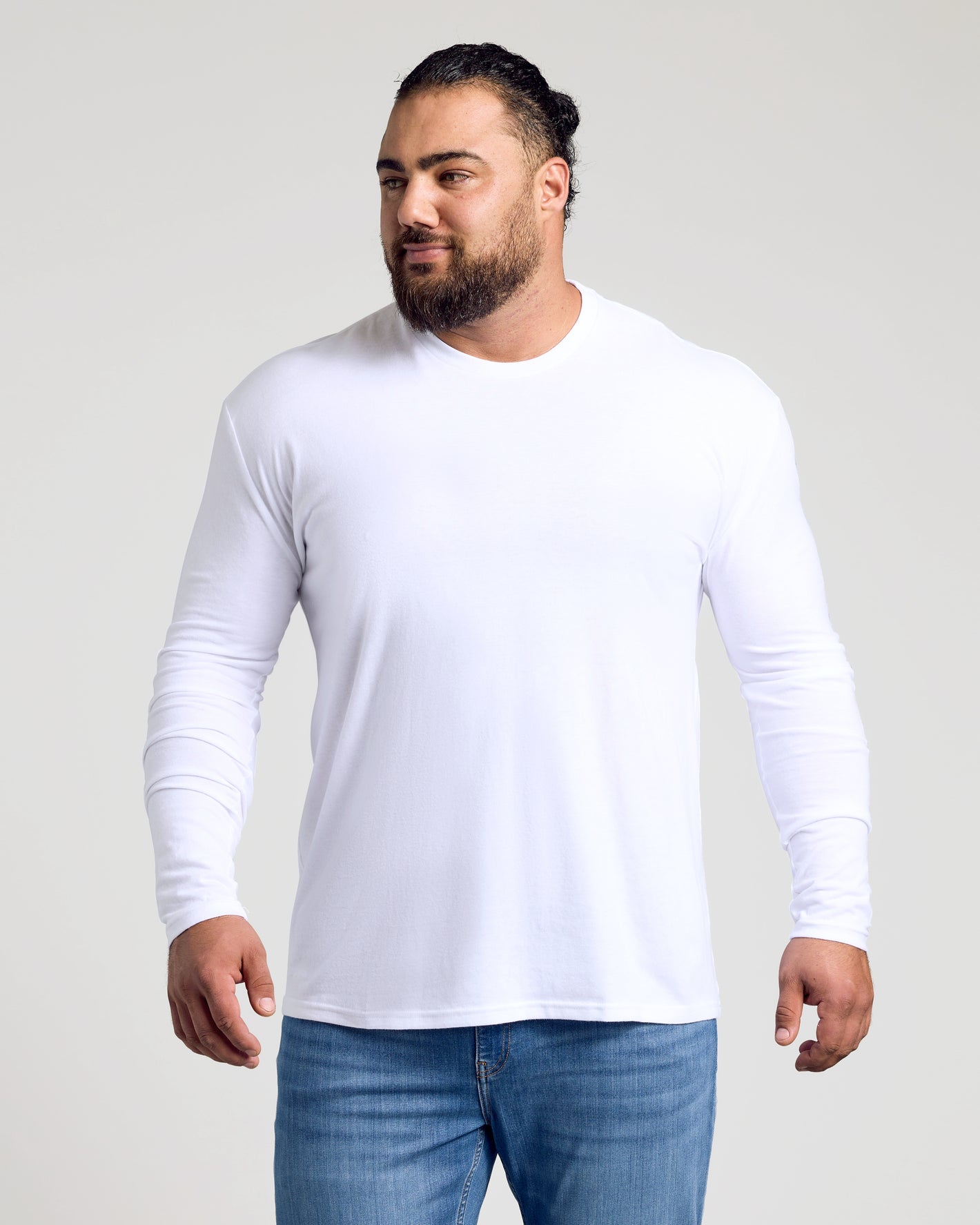 Man in Classic Long Sleeve 3-Pack, white T-shirt, blue jeans.