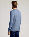 Fiord Dressy Crew Neck Sweater worn with dark jeans, back view.