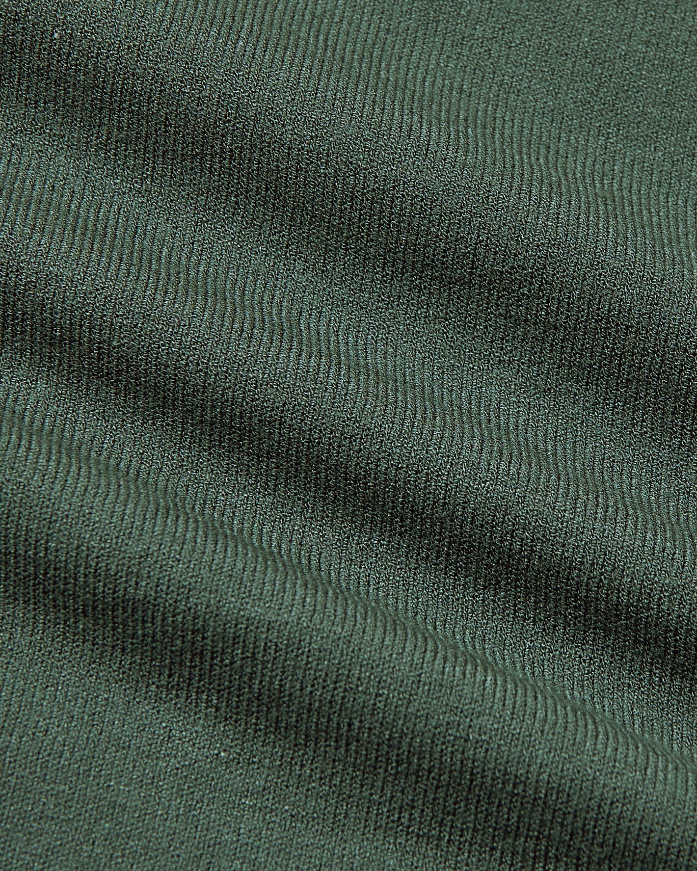 Close-up of Black & Moss Crew Neck Sweater's green knit texture.