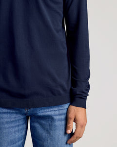 True ClassicPerson wearing Black & Navy Crew Neck Sweater over blue jeans.