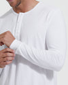 Man adjusting sleeves of All White Classic Henley.